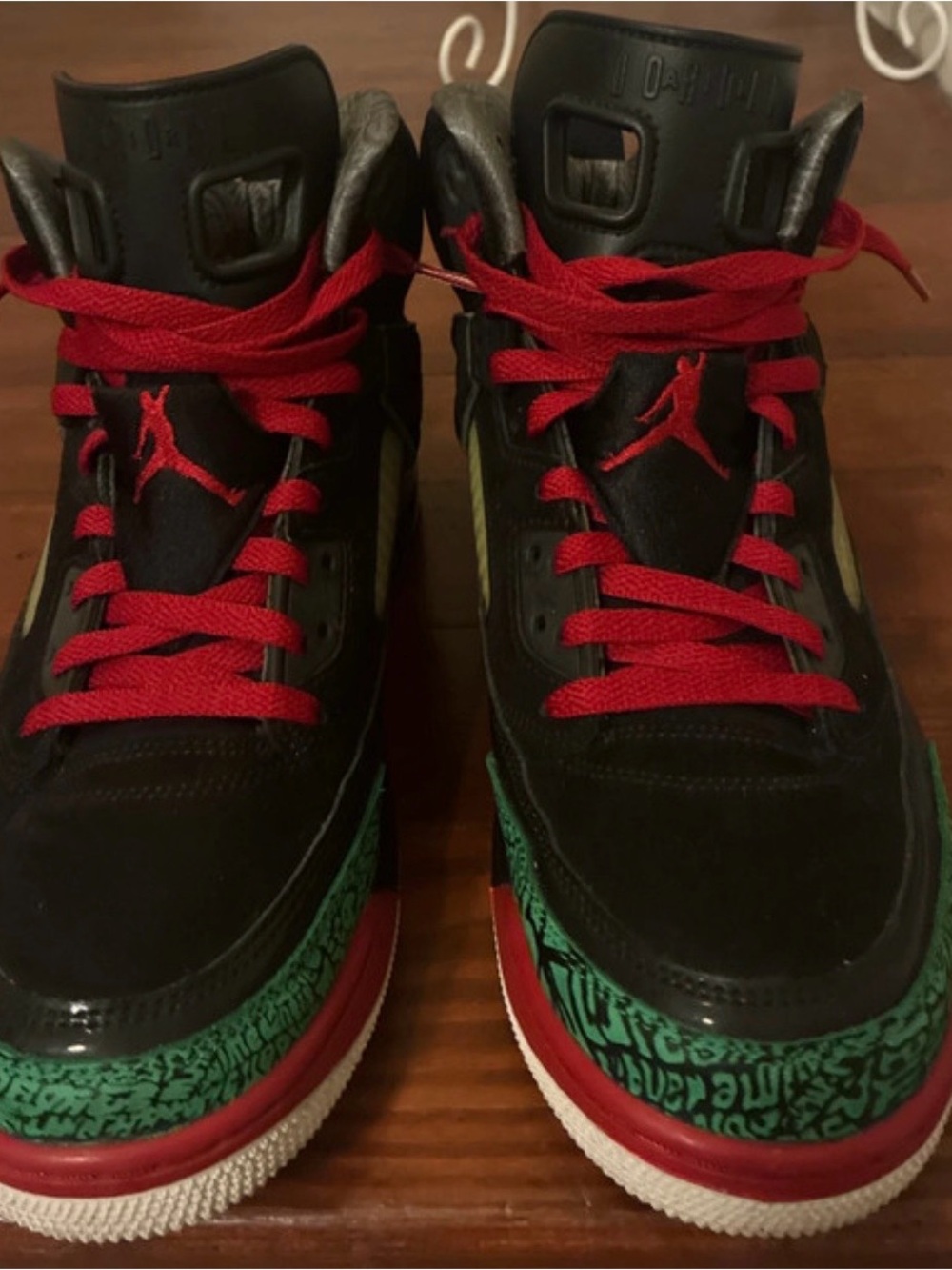 Jordan Black Athletic Shoes with Red Laces and Green Accent